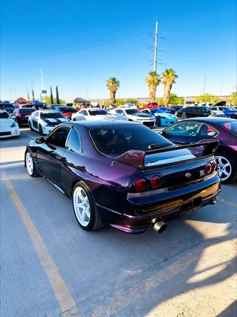 Detailed purple Nissan Skyline GT-R at a car show
